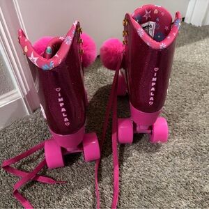 Woman’s Barbie Impala Sparkle Pink Roller Skates with Pom-Pom Accent